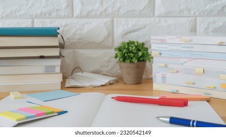 Open notebook and textbook. image of study.