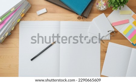 Open notebook and textbook. image of study.
