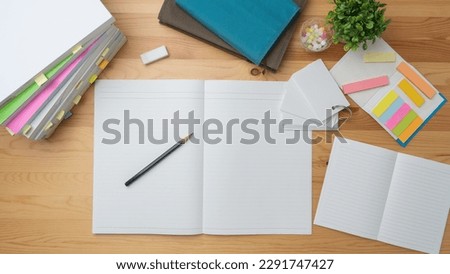 Open notebook and textbook. image of study.