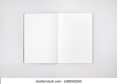 Open notepad mockup with white sheets on light gray background - Shutterstock ID 1688582050