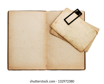 open old book with postcard isolated on white background with clipping path. vintage. ephemera