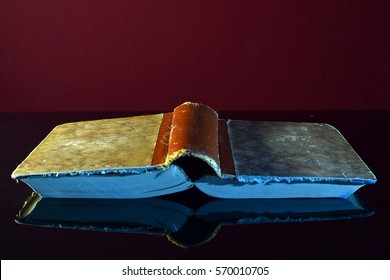 Open old book upside down. - Powered by Shutterstock