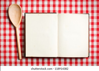 open old recipe book on checkered tablecloth