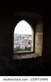 open old window serving as frame taking on the old city background