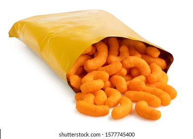 Open packet of extruded cheese puffs spilling out isolated on white.