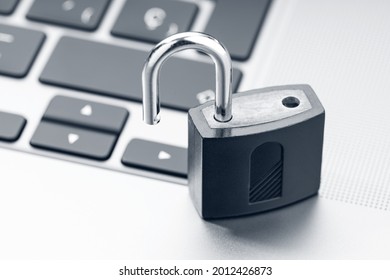 Open Padlock On Modern Laptop. Computer Security Vulnerability Concept