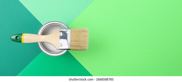 Open Paint Enamel Cans On Color Palette Samples. The Concept Of Repair, Construction. Shades Of Green.