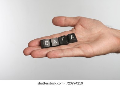 Open palm with four computer buttons with word DATA