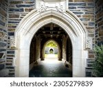 Open passage in an arched and aligned stone building. the Building forms part of the student dormitories at Duke University in Durham