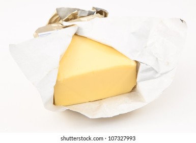 Open Pat Of Butter Against White Background