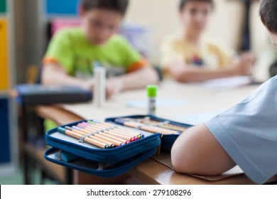 Open Pencil Box On Wooden Classroom Table