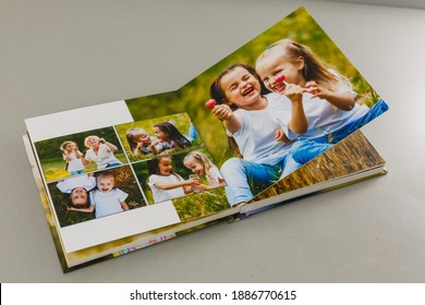 Open Photo Book On A Gray Background