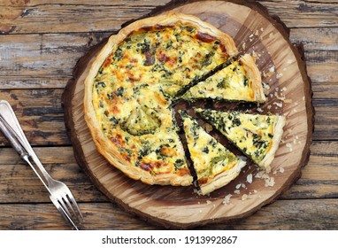 open pie made from puff pastry, broccoli, egg spinach, cheese. 