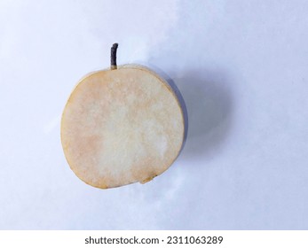 The open pieces of the pear are too long to brown the flesh. Top view - Shutterstock ID 2311063289