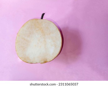 The open pieces of the pear are too long to brown the flesh. Top view - Shutterstock ID 2311065037