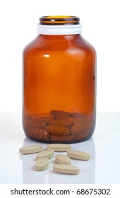 Open Pill Bottle With Medicine Spilling Out