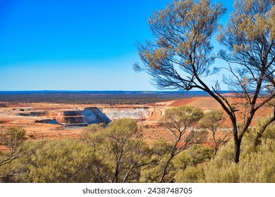 Open pit gold mine in the vast expanse of the Western Australian outback, close to the town of Mount Magnet
 - Powered by Shutterstock