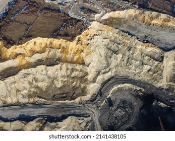 Open Pit Mine. Coal Mining, Aerial Drone View. Trucks Carry Ore. Mining Industry.