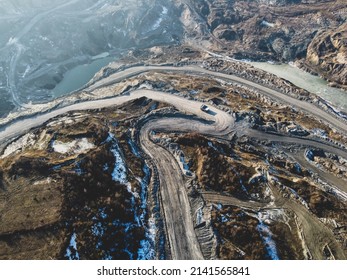 Open Pit Mine. Coal Mining, Aerial Drone View. Trucks Carry Ore. Mining Industry.