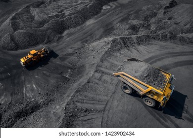 Open Pit Mine Industry, Big Yellow Mining Truck For Coal, Top View Aerial.