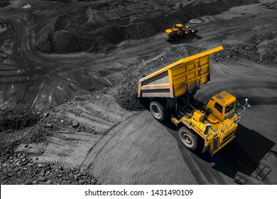 Open Pit Mine Industry, Big Yellow Mining Truck For Coal, Top View Aerial Drone.