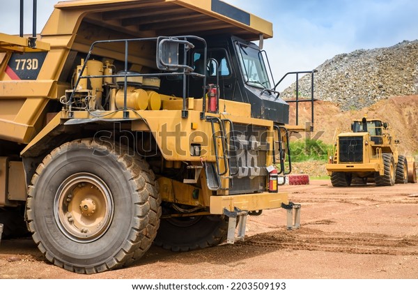 Open pit mine industry, big yellow mining\
truck for coal anthracite.