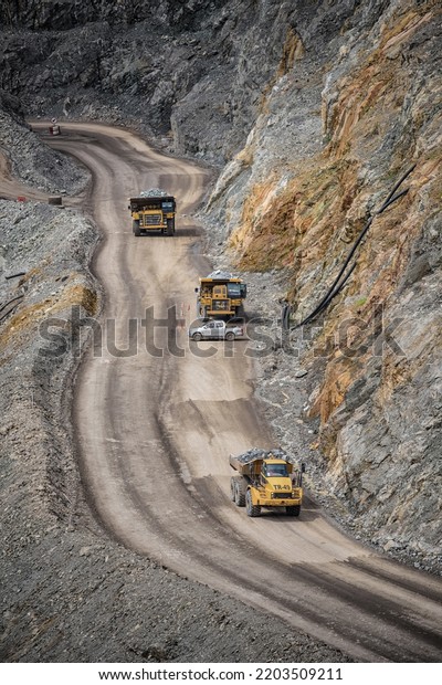 Open pit mine industry, big yellow mining\
truck for coal anthracite.