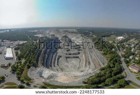 Open pit mine mine located in Pargas. Industrial mining operation in Finland. Scaring the earth. Natural resources of finland. Sunny summer day