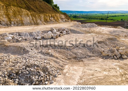 Open pit mining of construction sand stone materials.