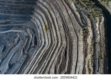 Open Pit Mining For Steel Production. A Giant Iron Ore Quarry. Aerial View Of An Open Pit Quarry