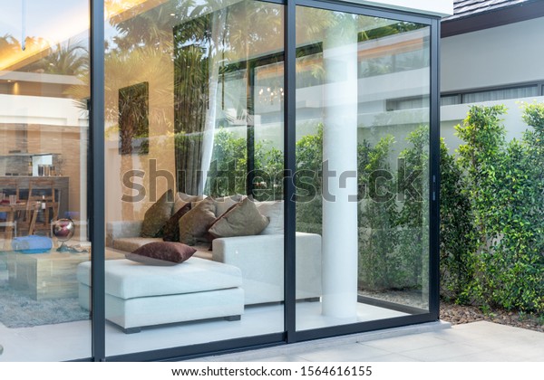 open plan\
living area with sliding door and\
garden