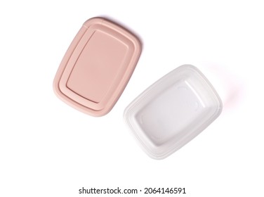 Open Plastic Food Storage Container With Pink Lid Isolated On White Background Table. Food Box For Lunch. Close Up. Top View