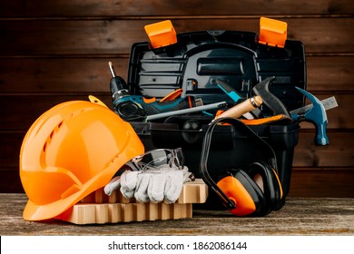 Open Plastic Tool Kit Box With Construction Safety Helmet And Various Hand Tools.