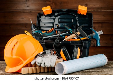 Open Plastic Tool Kit Box With Construction Safety Helmet And Various Hand Tools.