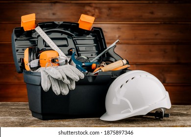 Open Plastic Tool Kit Box With Construction Safety Helmet And Various Hand Tools.