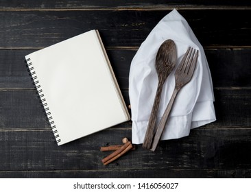 Open Recipe Book,chef Hat And Spoons On Wood Background,top View