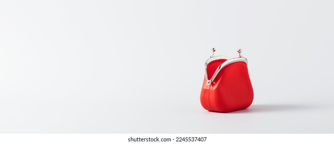 Open Red Coin Purse on blue background with copy space,  banner, minimalistic style. Financial crisis, poverty, lack of money concept