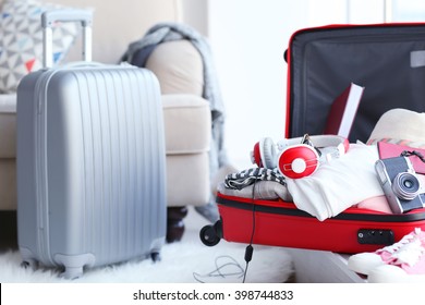 Open Red Suitcase On The Floor, Close Up