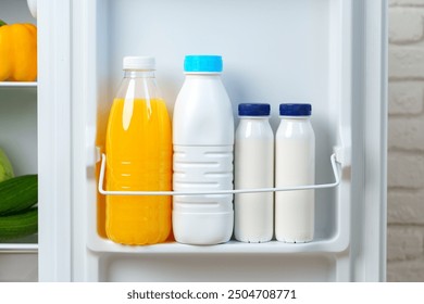 Open Refrigerator Door With Juice, Milk, and Fresh Produce - Powered by Shutterstock