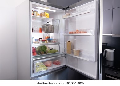 Open Refrigerator Filled With Fresh Fruits And Vegetable