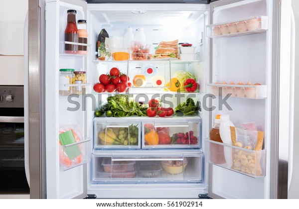 Open\
Refrigerator Filled With Fresh Fruits And\
Vegetable