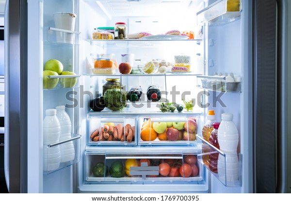 Open\
Refrigerator Or Fridge Door With Food\
Inside