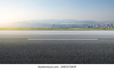 Open Road Leading to Urban Skyline at Sunrise - Powered by Shutterstock