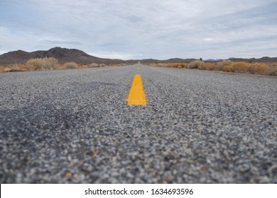 Open Road. No Car. Yellow Strip. Cloudy Day