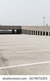 Open rooftop parking deck with empty spaces.