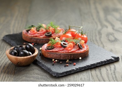 Open Rye Sandwich With Salami And Vegetables