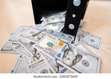 Open safe door against dollar money. - Shutterstock ID 2281873649
