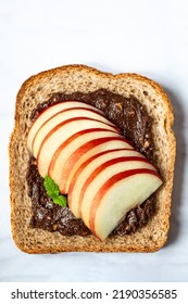 Open Sandwich With Sliced Peach Fruit And Walnut. Made From Wholegrain Bread Slice And Chocolate Crunchy Cashew Nut Butter, Healthy Nutritious Snack Option