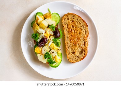 Open Sandwich With Traditional German Potato Salad And A Piece Of Bread On A White Plate. Top View, Horizontal Orientation