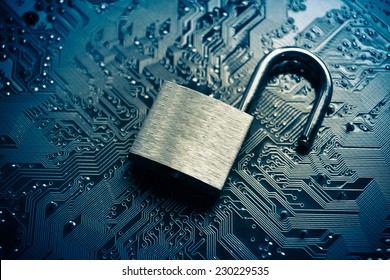 open security lock on computer circuit board - computer security breach concept